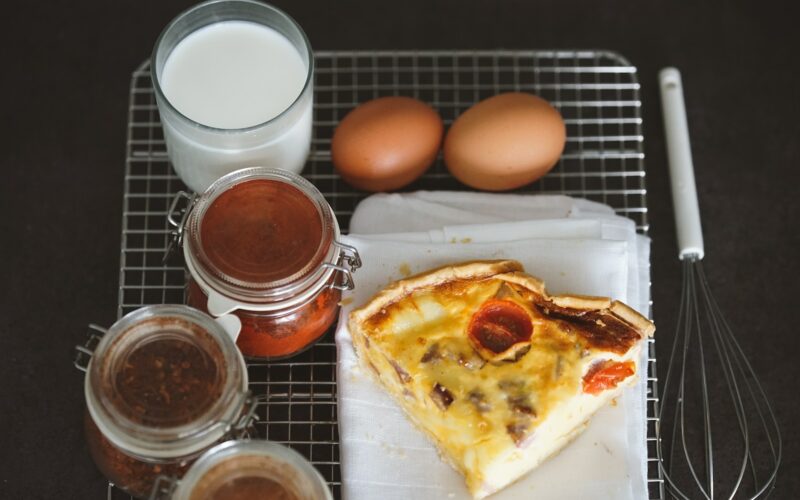 a piece of pizza sitting on top of a white plate