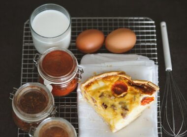 a piece of pizza sitting on top of a white plate