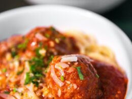 meta balls with noodles served on white ceramic bowl