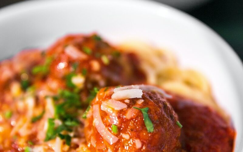 meta balls with noodles served on white ceramic bowl