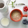 bowl of cereal near white pitcher