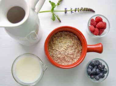 bowl of cereal near white pitcher