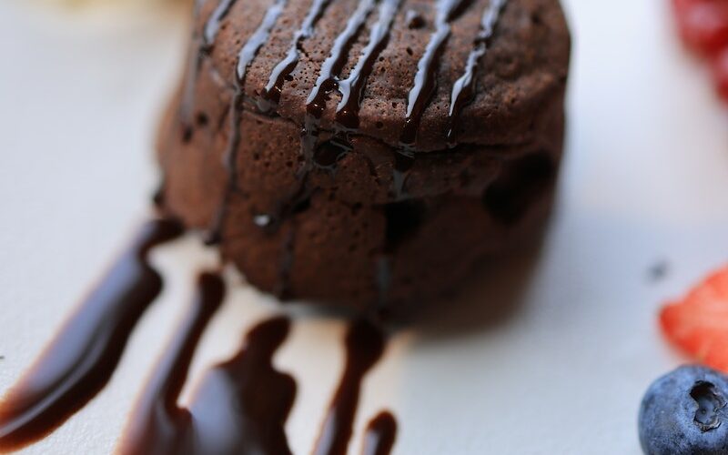 Chocolate Ice Cream With Cherry on White Ceramic Plate