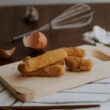 fried croqueta on chopping board