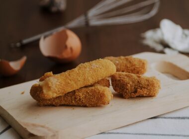 fried croqueta on chopping board