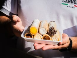 person holding white plastic container with bread