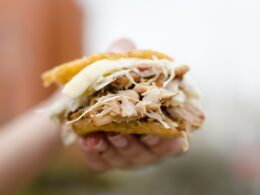 person holding brown and white bread