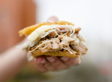 person holding brown and white bread