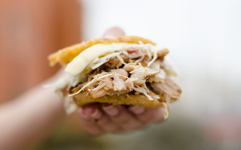 person holding brown and white bread