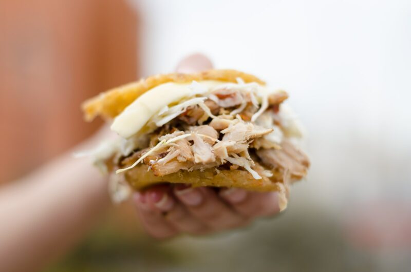 person holding brown and white bread