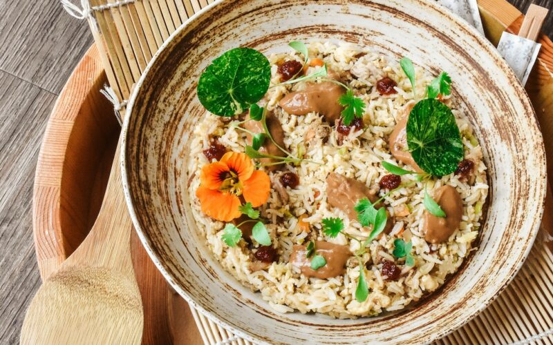 brown wooden bowl with food